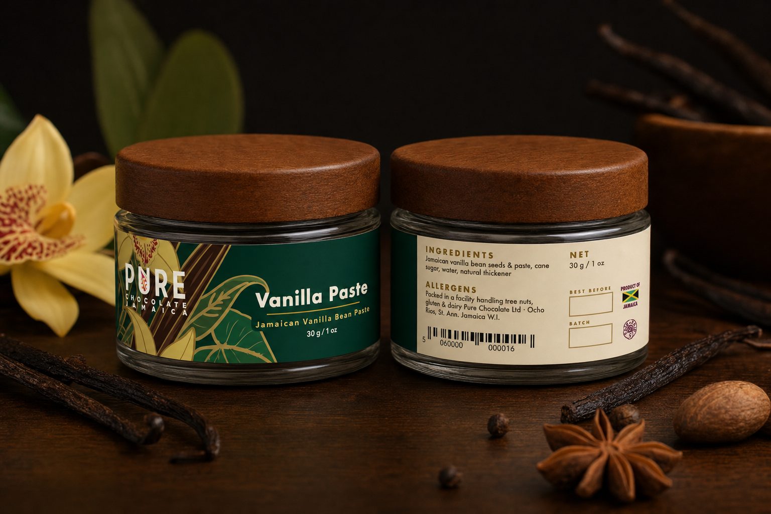 Vanilla Paste jars front and back — wooden-lidded jars with a deep-green painted wrap of vanilla orchids and pods, beside a fresh orchid bloom.
